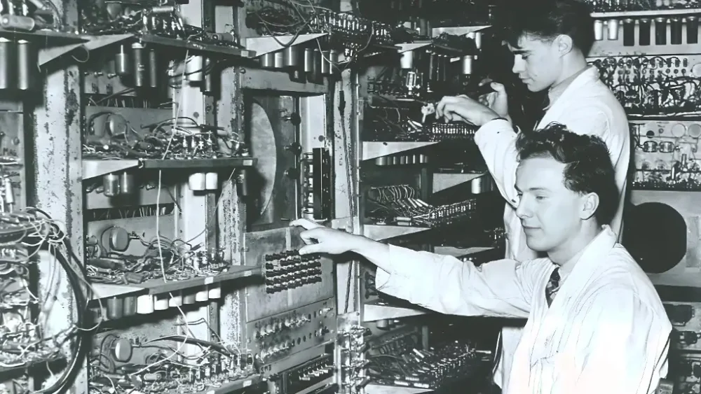 Illustration of Alan Turing with a Turing Machine diagram representing the origin of computer science
